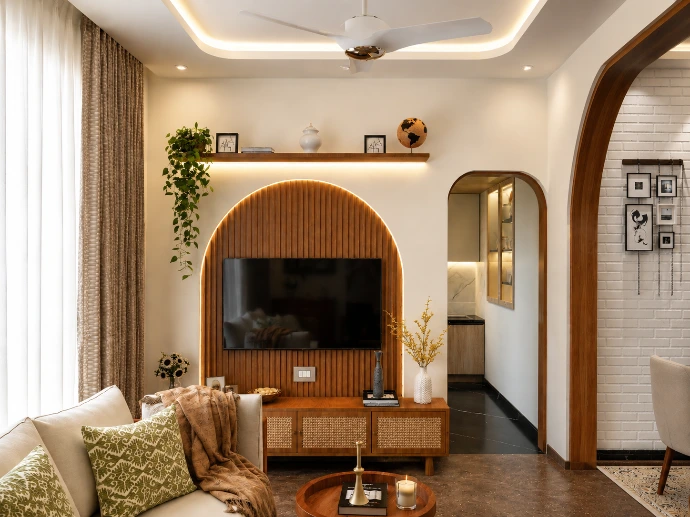 Elegant living room with arched feature wall designed by Kalakaar Homes