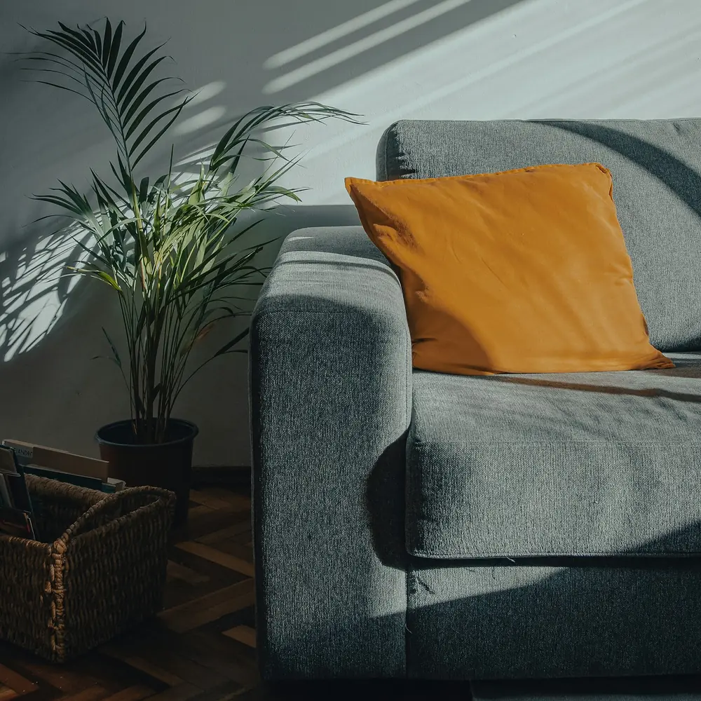 Modern lounge chair and living space interior designed by Kalakaar Homes